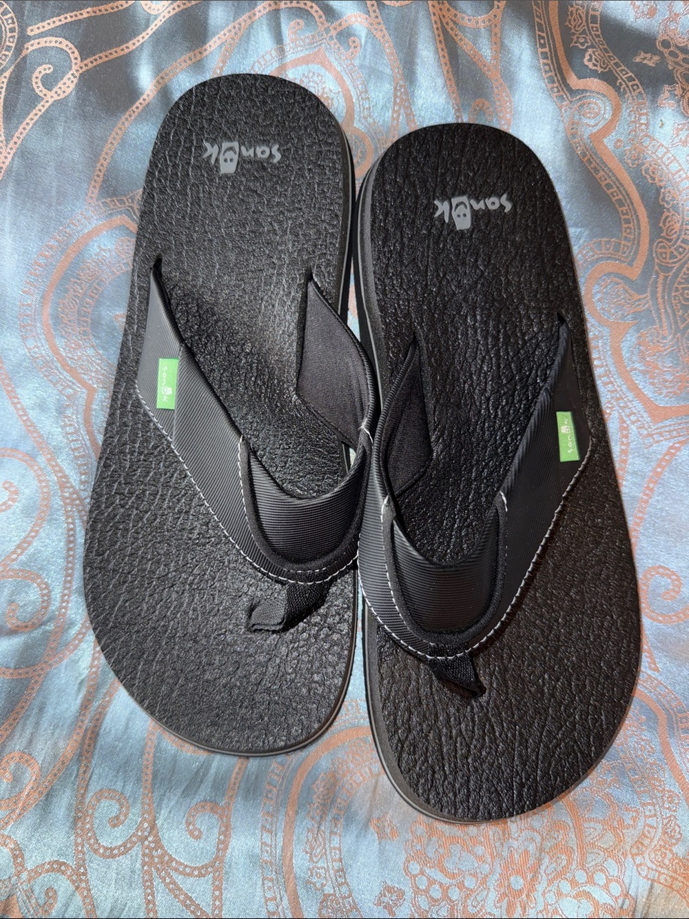 Sanuk Black Textured Foam Flip Flops with Green Tags
